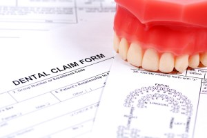 insurance paper and model of teeth